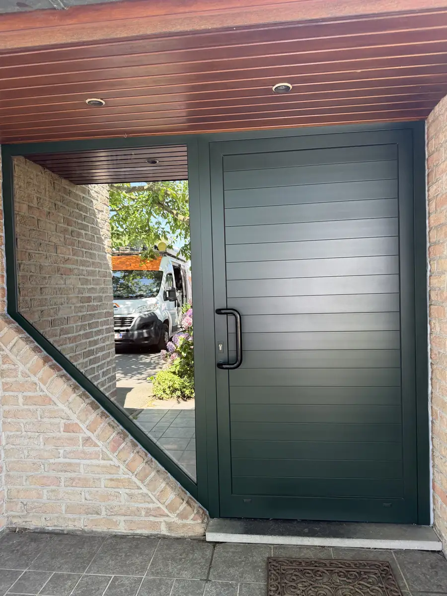 The same front door after refinishing in dark green The same front door after refinishing in dark green