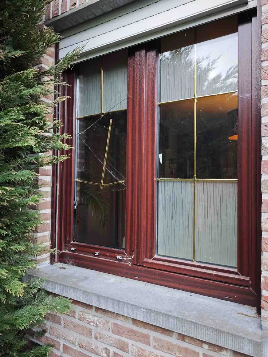 PVC window with visible burglary damage before repair PVC window with visible burglary damage before repair